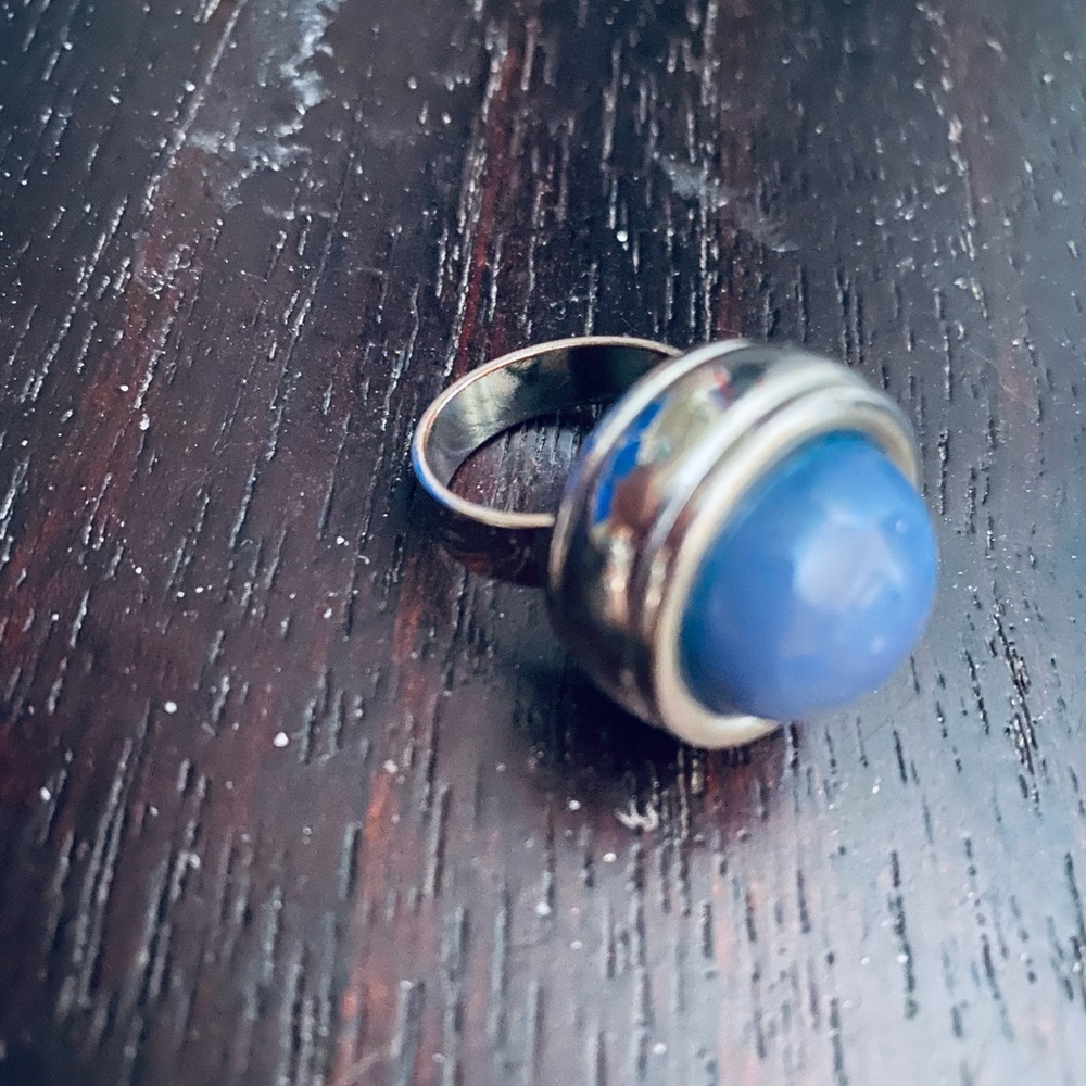 Irredentist blue round stone ring